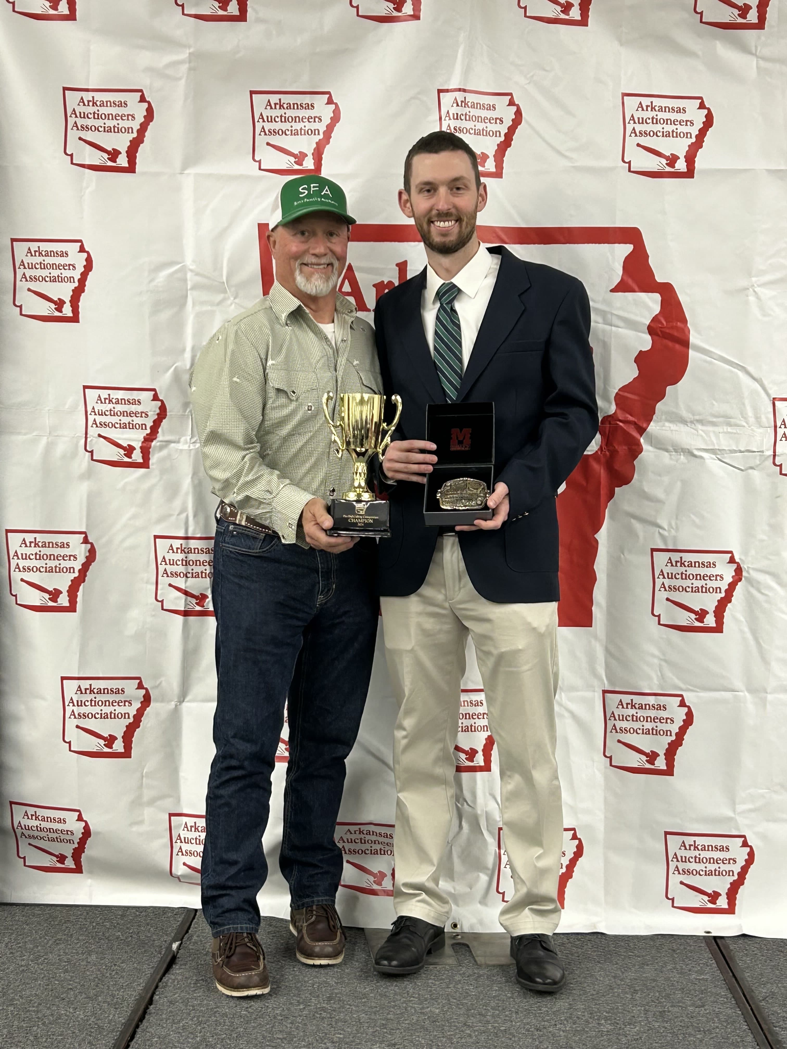 Sims Family Auctions auctioneers holding their awards